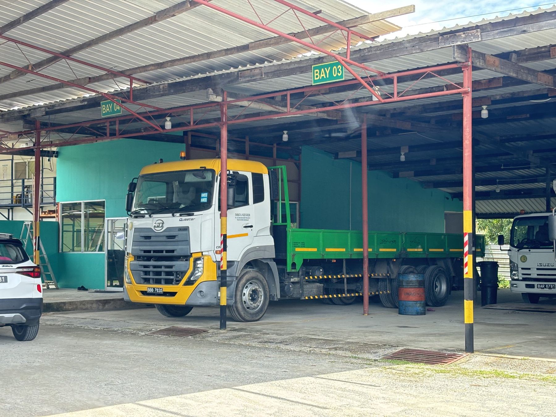 SHYT truck parked in a bay at the company yard