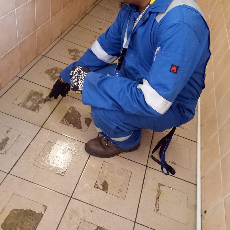 Scraping stubborn stains off floor tiles