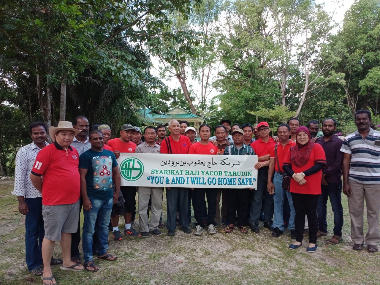 SHYT crews holding a banner reading You and I will go home safe