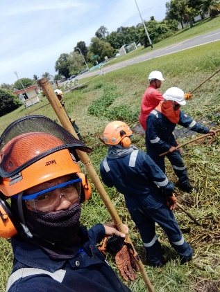 SHYT crew in helmets and face shields at work