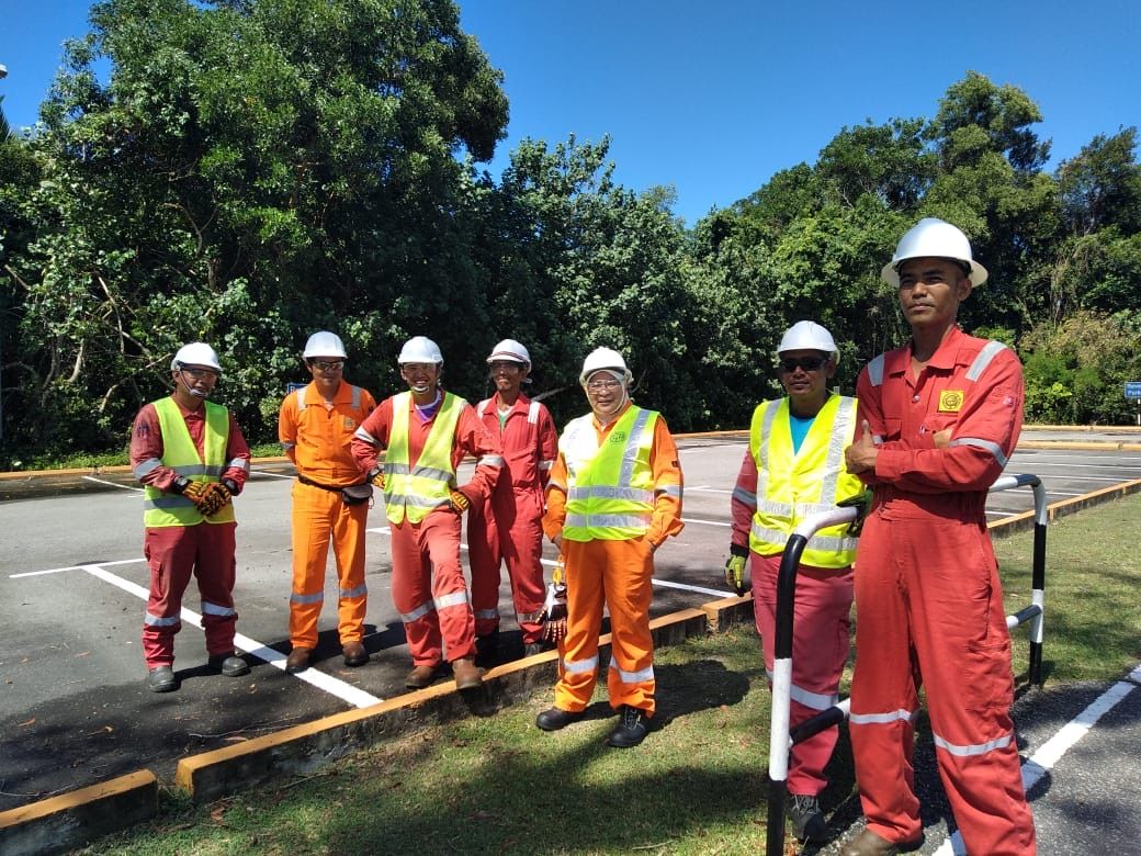 SHYT supervisors and crew in hard hats, coveralls and hi-vis vests on site